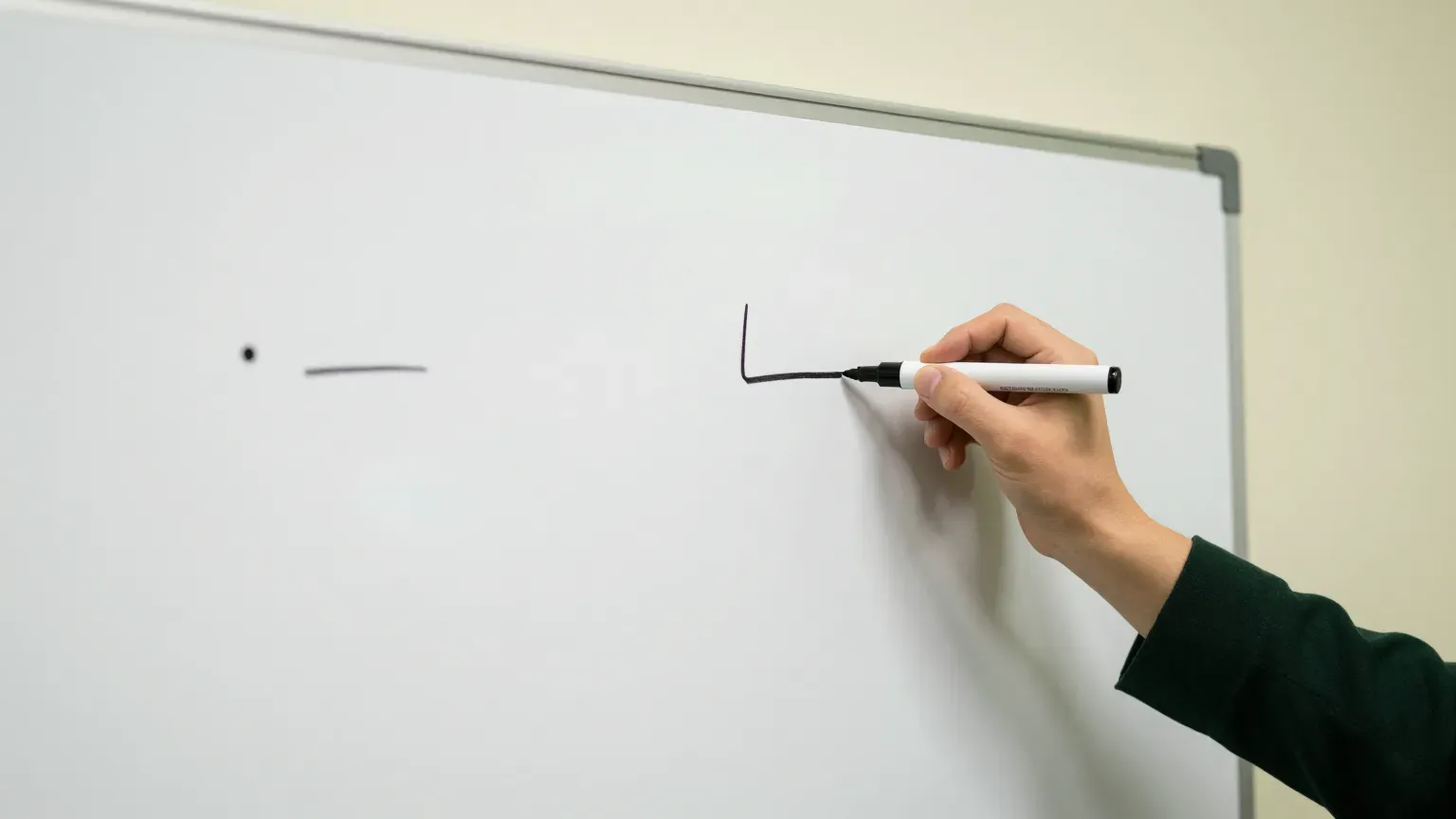 a whiteboard with two columns sketched out, hands only